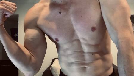 Devon flexing his muscles up close