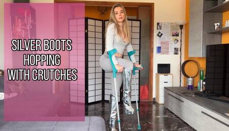 Silver boots hopping with crutches