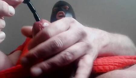 Masked slave fucks his cock with the dilator as if it were a pussy. Deep and intense urethral sounding.