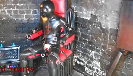 latex gimp tied up in the milking chair