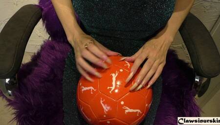 I try to destroy this soccer ball with a few nails, but in the end I puncture it with my pinky