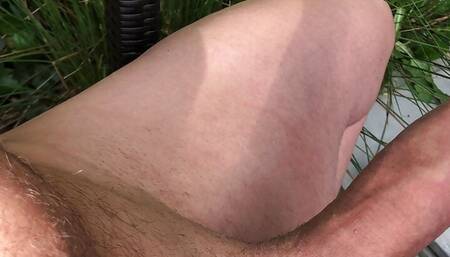 Masterbating in the garden.