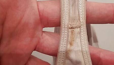 Dirty white string and dirty black panties laundries full sperm