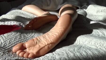 Feet tickling with a feather
