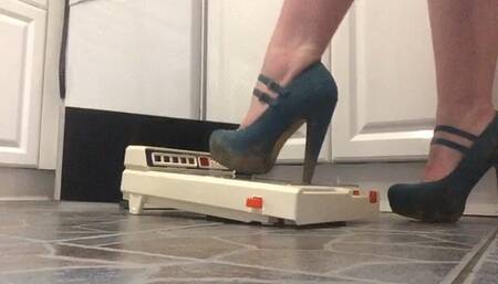 Teal strappy heels with metal tip destroy historic pin ball game