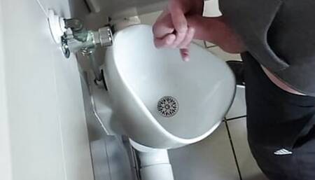 Wank at public toilet