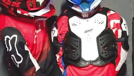 A guy in a motocross gear gets a portion on his mxhelmet