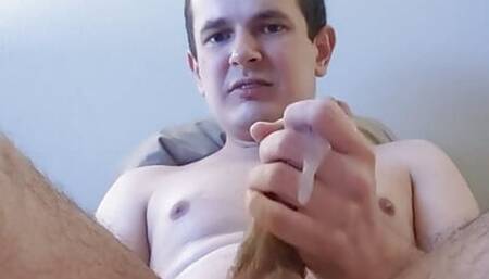 Guy jerks off until he has a handful of cum leak out through his fingers