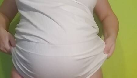 White dress. Showing. 8 months pregnant