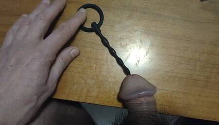 Urethral insertion with a small penis plug all the way in