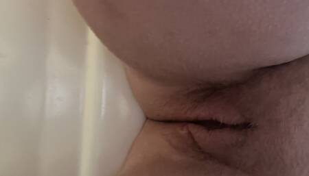 Horny milf's pink dildo tearing up hairy puss and causing her to squirt