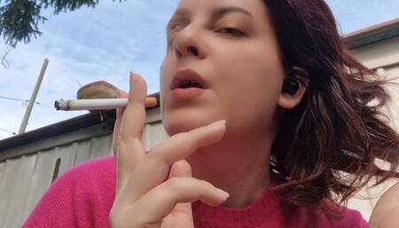 Beautiful italian milf smoking a cigarette in the garden in a sensual way 1080HD