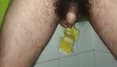 Indian middle age man use toilet brush and free hand cum