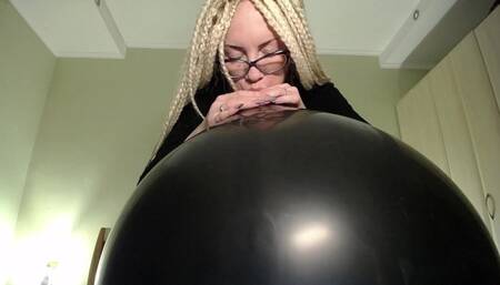 Blow big black balloon & pop with nails