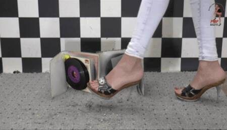 Old records crushed under high heel Mules