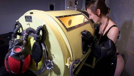 Iron Lung: Vacuum Sack - Heavy and Elise Graves - Heavy is sucked into a thin, rubber sack and locked into an IRON LUNG machine!