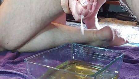 She pees in a pan and jerks me off into it