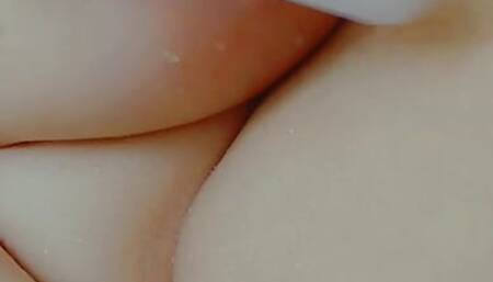 Chubby BBW plays with tits and fucks pussy with dildo in the shower
