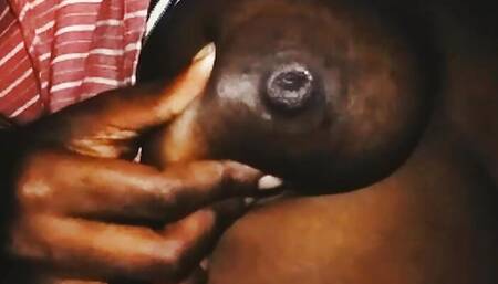 Playing with my boobs. Come suck them