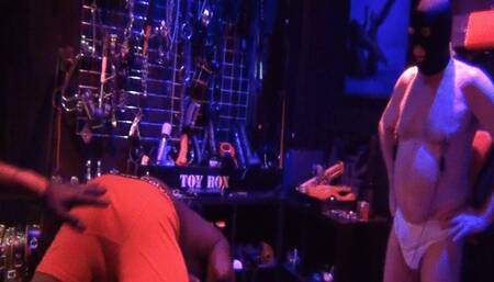 Strap-on on the big black cock slave in the dungeon