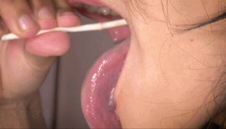 Beautiful Long, Wet Tongue and Moist Lips On A Lucky Lollipop