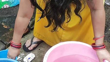Indian bhabhi bathing outside with