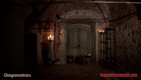 A witch is dangling over small flames