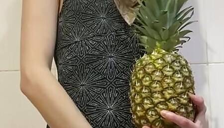 skinny girl playing with pineapple