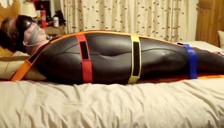 Desperately trying to escape from a tight fitting neoprene sleepsack before his torment begins-BBW bondage, BBW domination, amateur,male bondage,man in bondage, sleep sack,strapped down,bound and gagged man,struggling,