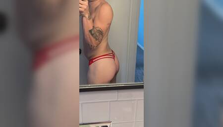 In front of window wearing thong