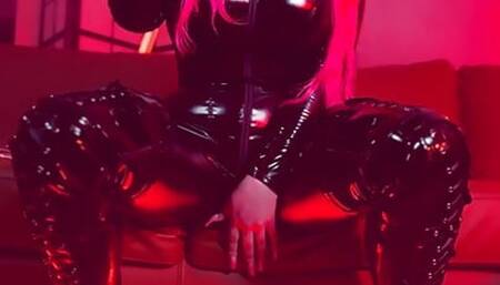 Pink haired Luvie Doll smoking her EVE 120s cigarette like a demon in her pvc catsuit and long fingernails