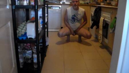 John is Peeing on the Kitchen Floor