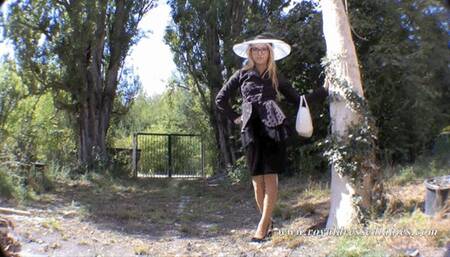 Elegant vintage lady pees in the garden