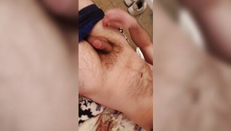 Laying Naked flaccid penis just starting to get erect