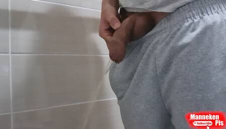 Guy pissing with uncircumcised cock and big balls
