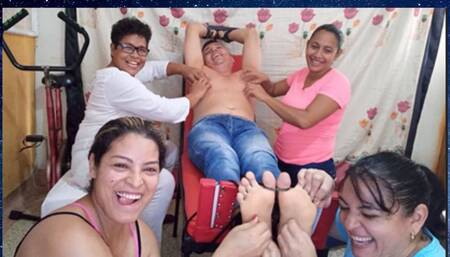 Male tickling: Four girls tickle a boy