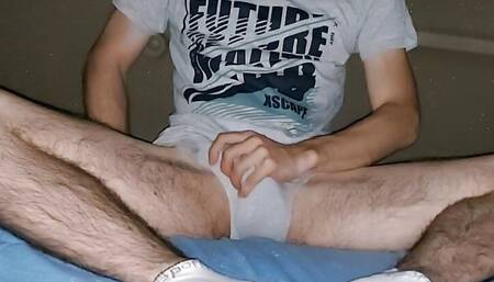 Teenager with grey underwear and sports socks masturbates and shots his sperm