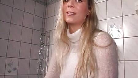 This sexy blonde neighbor with big tits shows how she sensually masturbates her shaved pussy