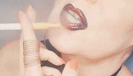 Your goddess Smokerqueenjoan smoking provocatively with many OMI's her Marlboro Red 100*cough*naked tits*black red lipstick