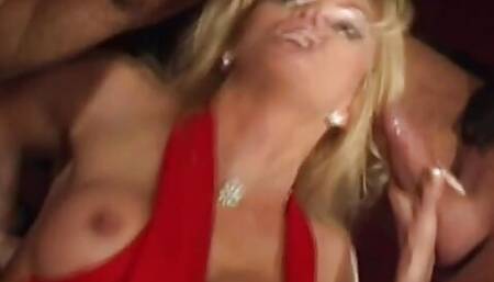 Blonde bitch wearing a sexy red dress gets fuck by a 3 hunky dudes