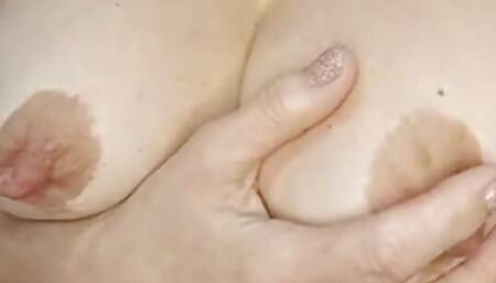 rubbing my huge tits and nipples in close-up