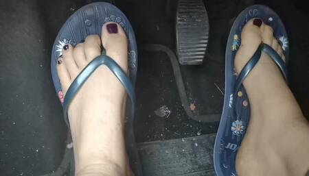 Sweaty feet in really tasty flip flops pedal pumping on the pedals of the car 1080HD