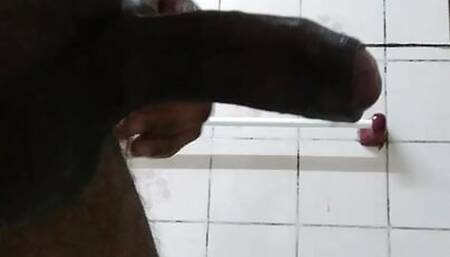 Young boy mastrubating in washroom