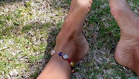 Sexy feet teasing outdoors
