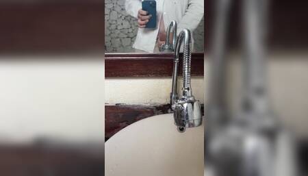 Young Guy in a Shirt Masturbates Thick Dick by a Mirror