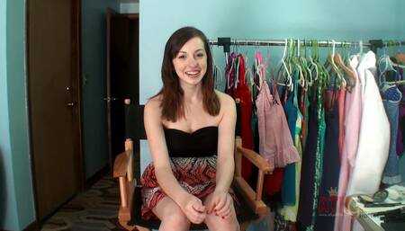 Ally Evans talks to an interviewer before she strips down in the bathroom, spreads her pussy, and pisses in the sink