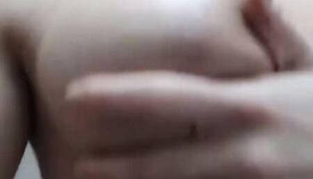 Sexy Chick oils up her big tits and ass