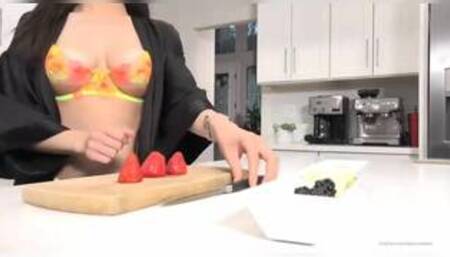 Darcie Dolce and Val Dodds on a kitchen counter in several lesbian scenes together