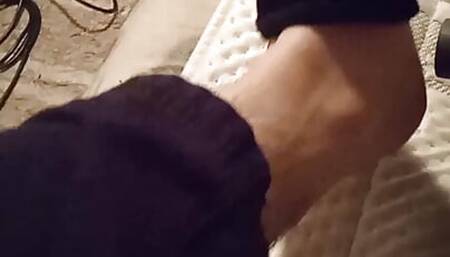 Vacuuming sock off and bare feet