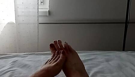 horny MILF translady talking in her sexy voice and showing off her red painted toes and her feet
